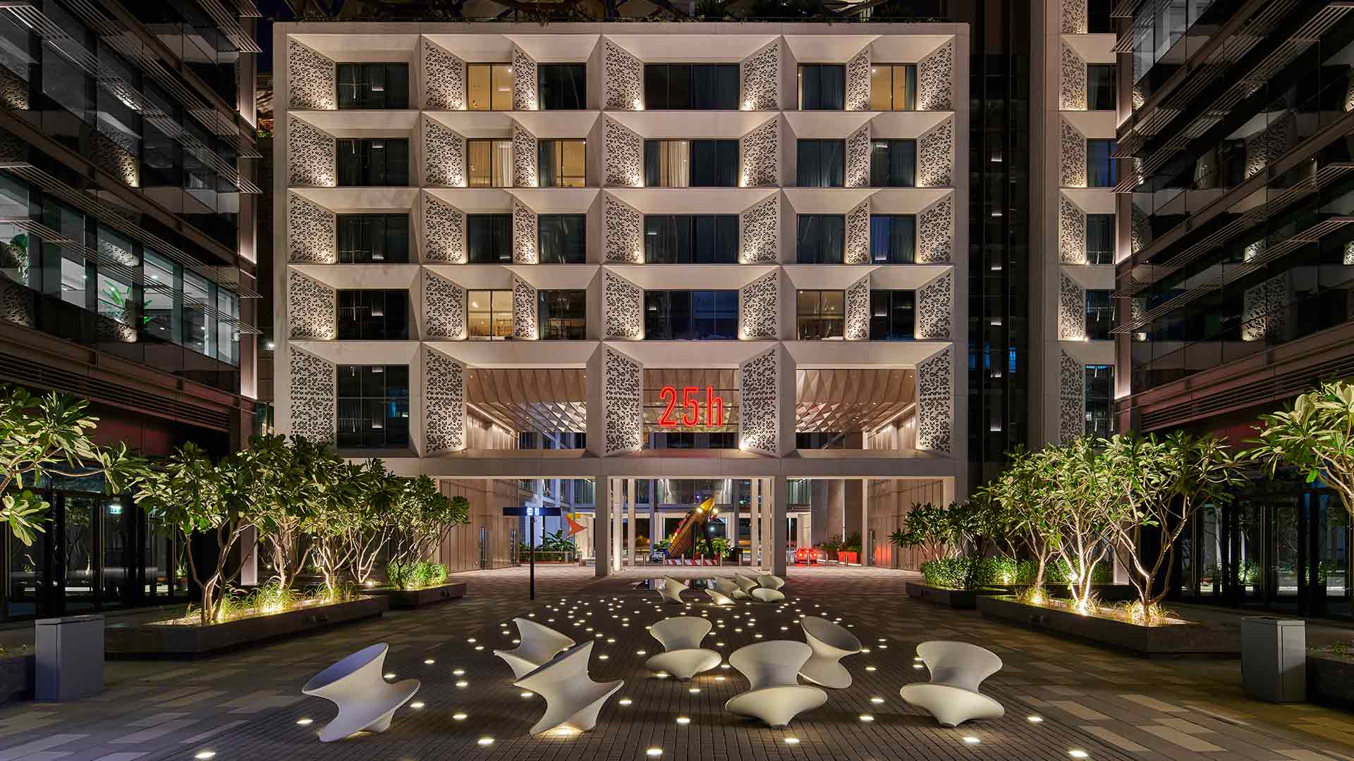exterior facade lighting design 25 hours hotel dubai illuminated pathway nulty banner